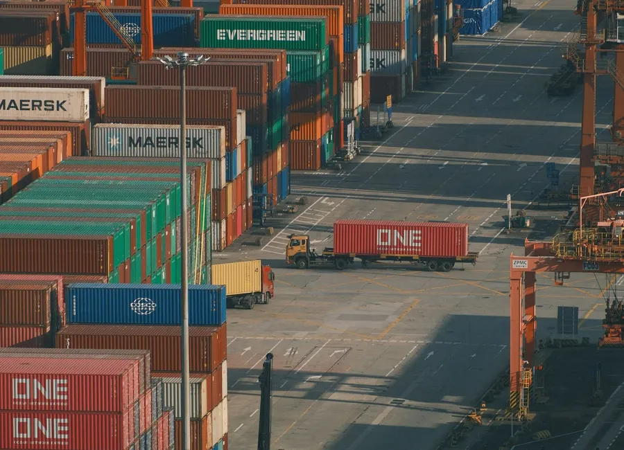 Shipping containers staged at a port terminal for export